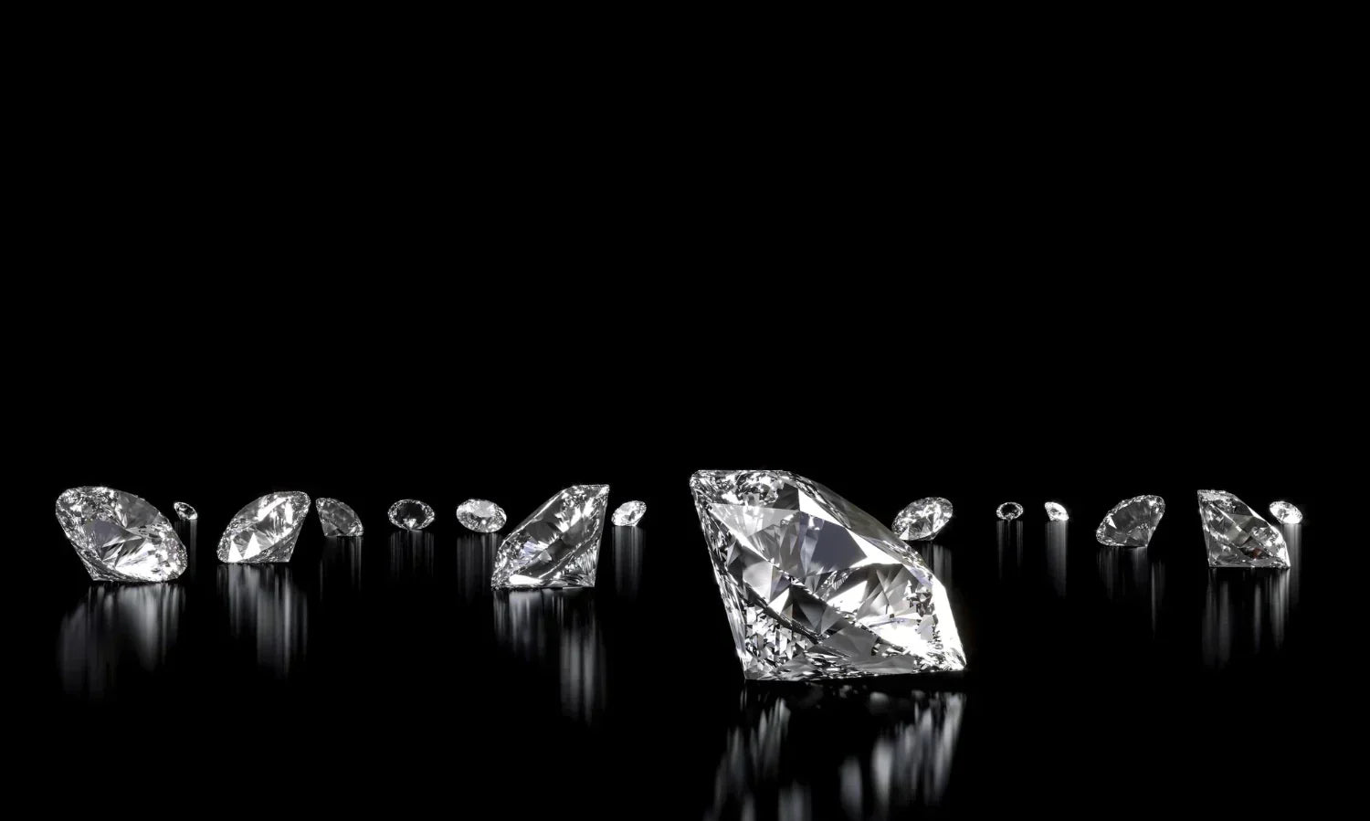 Row of sparkling diamonds reflecting on black glass.